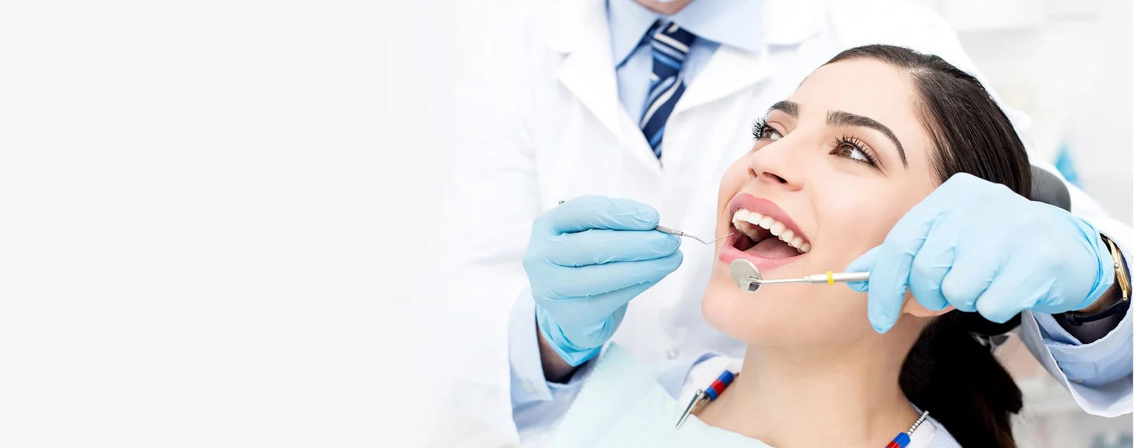 Smiling patient during a dental exam at Perfect Hollywood Smile
