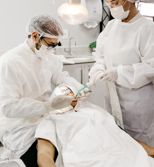 Dentist treating a patient during an urgent visit